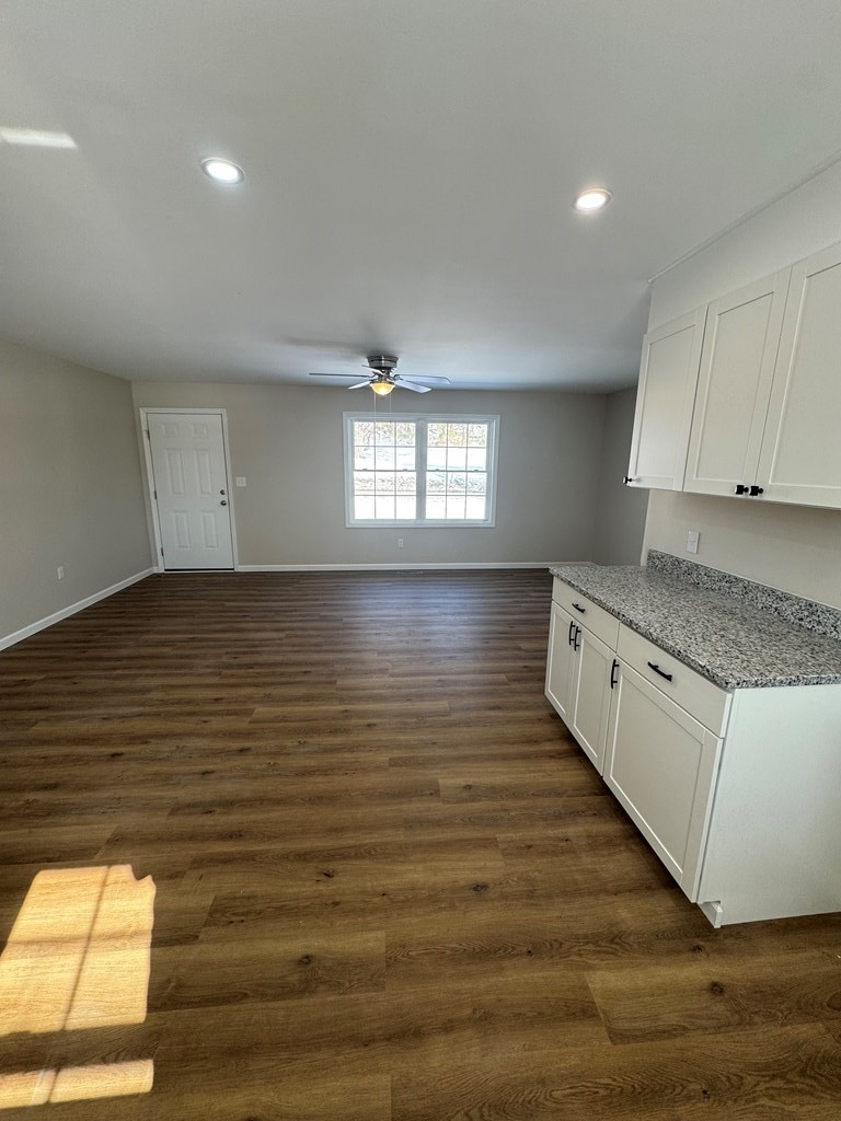 1106 East Railroad Street Waverly, TN 37185 - Photo 10 of 21 a large kitchen with stainless steel appliances granite countertop a stove and a large window