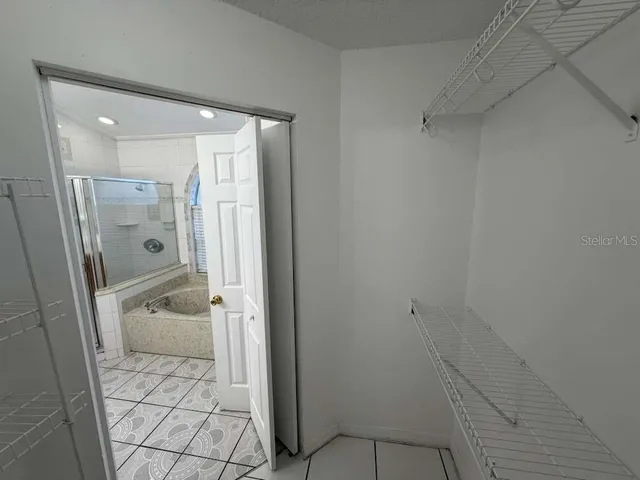a bathroom with a shower and a sink
