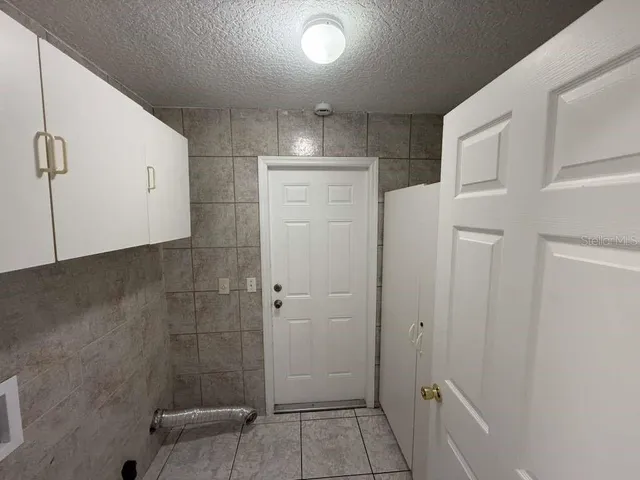 a wooden bench sitting in middle of a yard