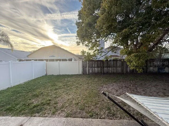 an empty room with a empty space and windows