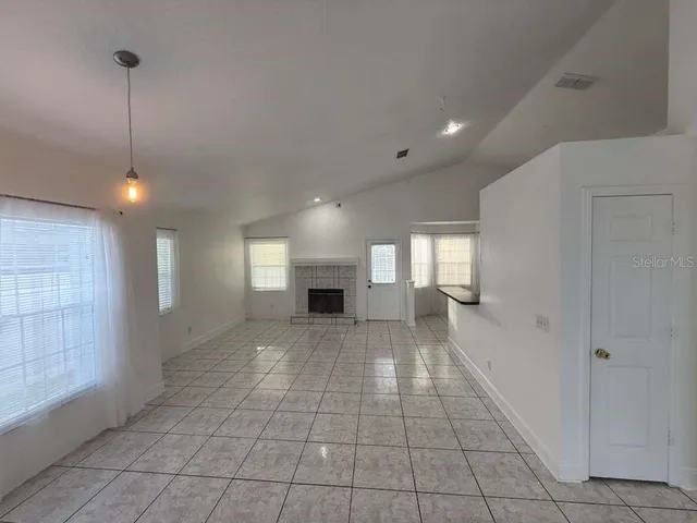 a view of empty room with windows