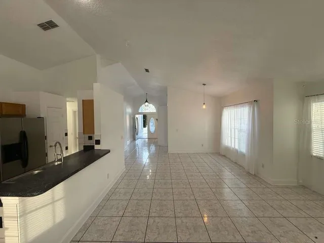a large bathroom with a sink and a large mirror