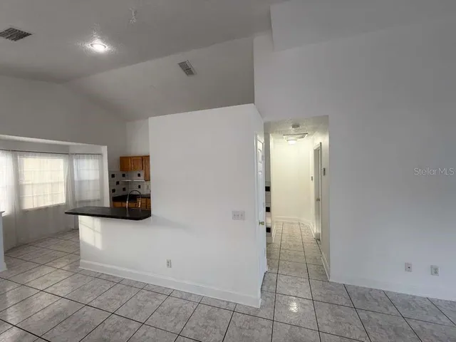 a view of a kitchen and utility room