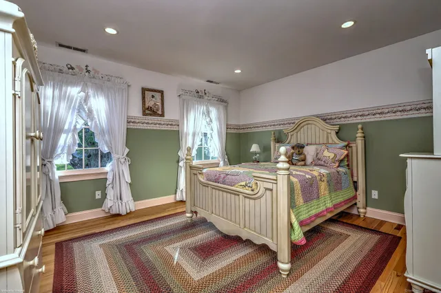 a bed room with a bed and a window