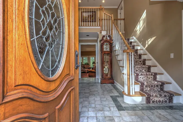 a view of a entryway door with wooden floor