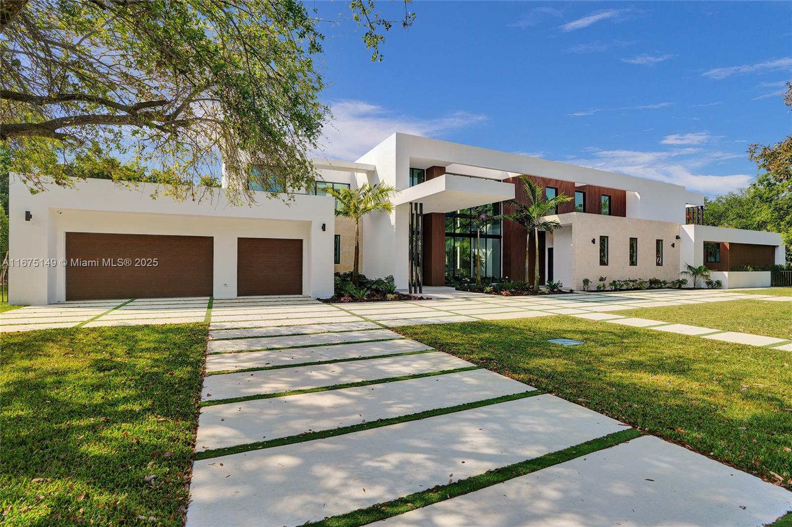 a front view of a house with a yard porch and outdoor seating