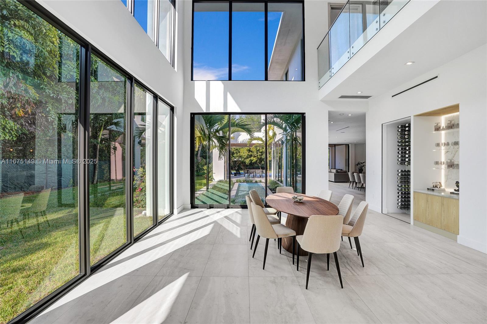 6350 Southwest 112th Street Pinecrest, FL 33156 - Photo 20 of 88 a dining room with furniture water view and balcony