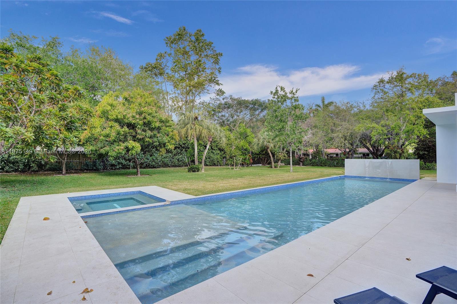 6350 Southwest 112th Street Pinecrest, FL 33156 - Photo 31 of 88 a view of swimming pool with a yard