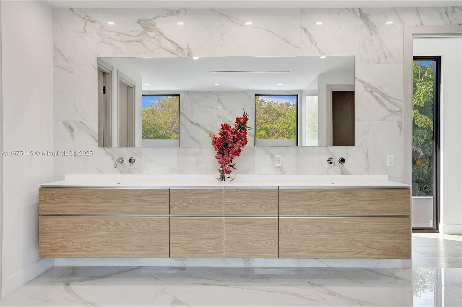 6350 Southwest 112th Street Pinecrest, FL 33156 - Photo 58 of 88 a bathroom with a sink bath tub and a mirror