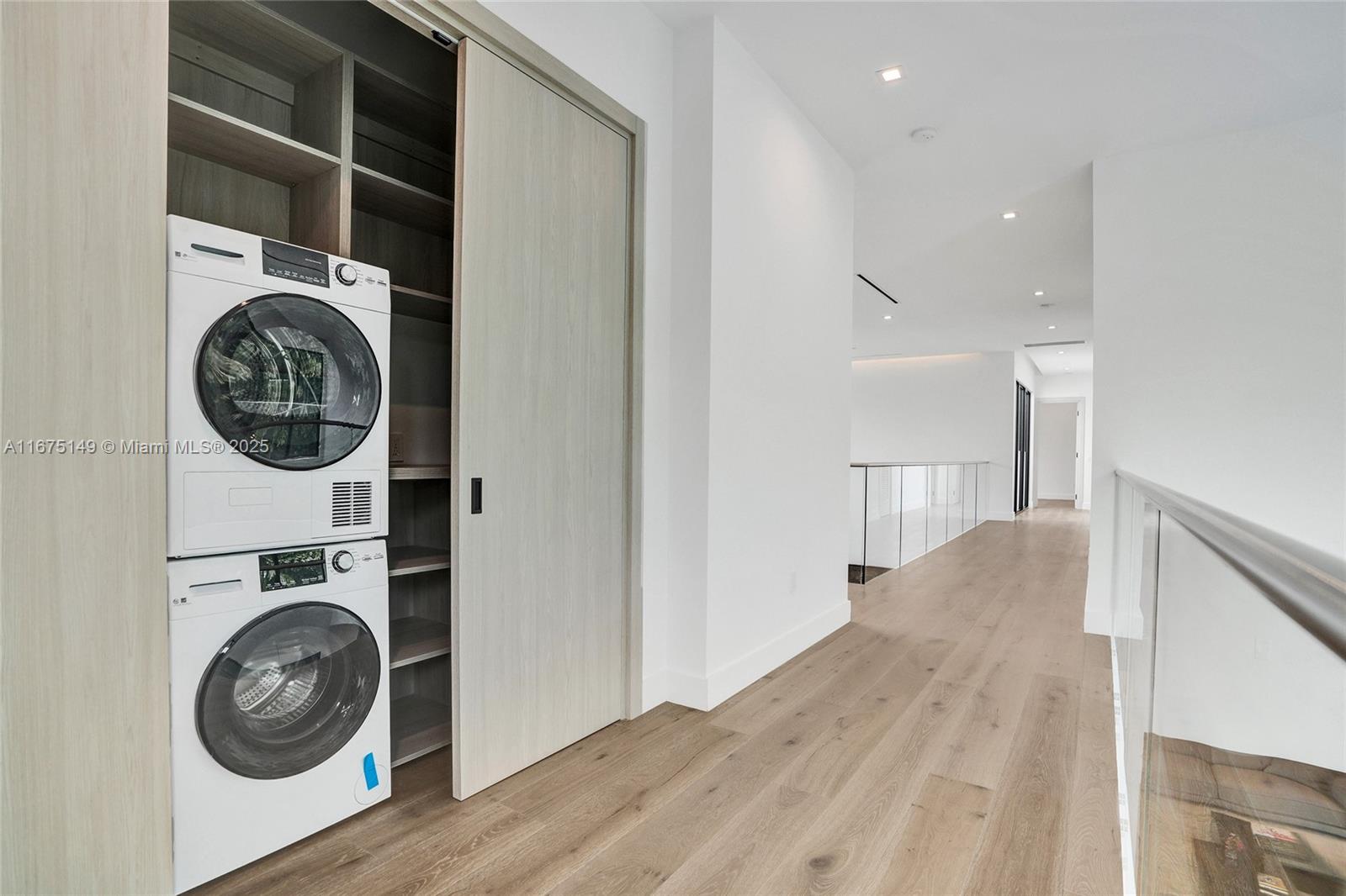 6350 Southwest 112th Street Pinecrest, FL 33156 - Photo 61 of 88 a view of a hallway with washer and dryer