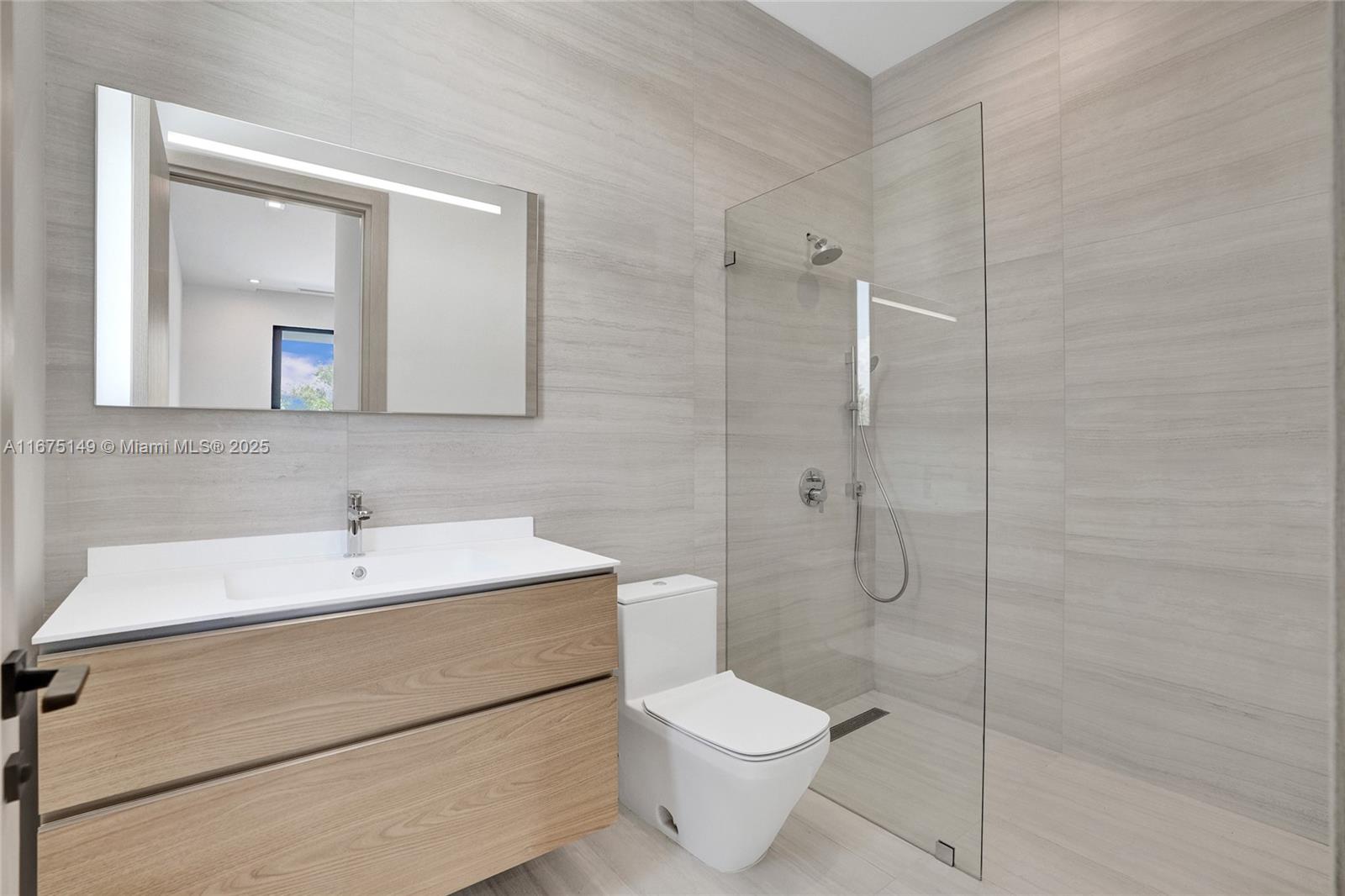 6350 Southwest 112th Street Pinecrest, FL 33156 - Photo 72 of 88 a bathroom with a toilet sink and shower