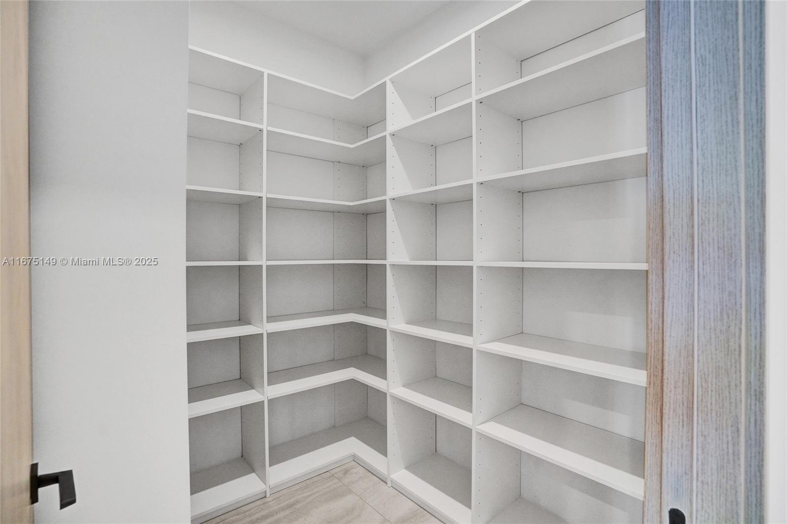 6350 Southwest 112th Street Pinecrest, FL 33156 - Photo 80 of 88 a view of a room with shelf on the wall