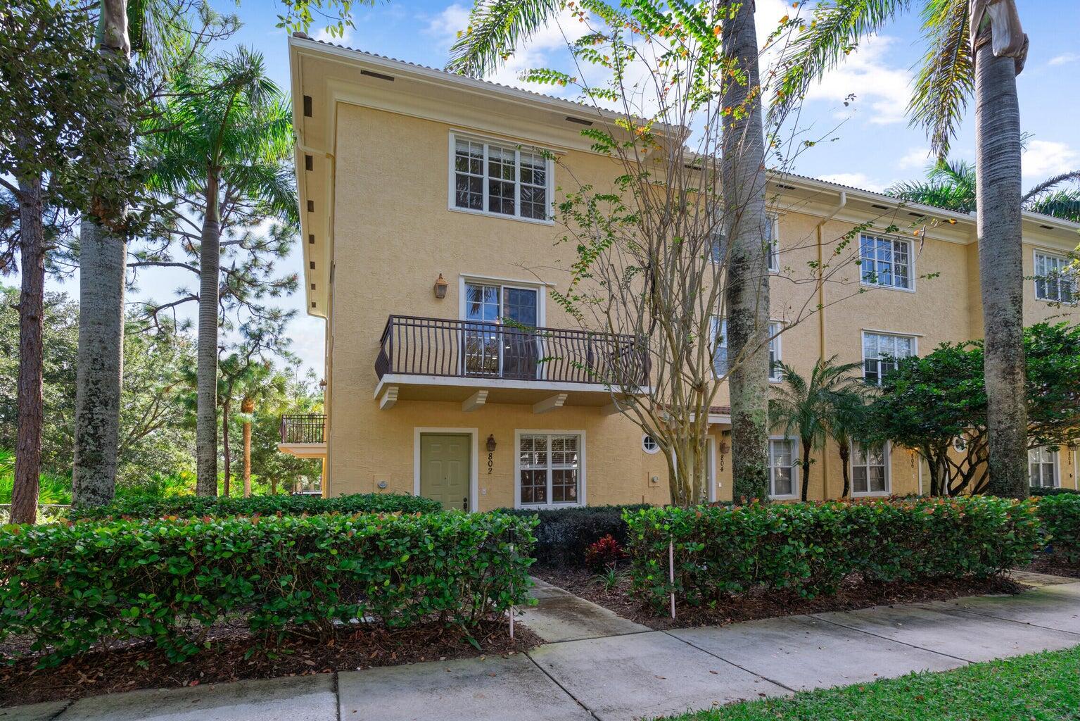 802 University Boulevard Jupiter, FL 33458 - Photo 1 of 40 a front view of a house with plants and trees