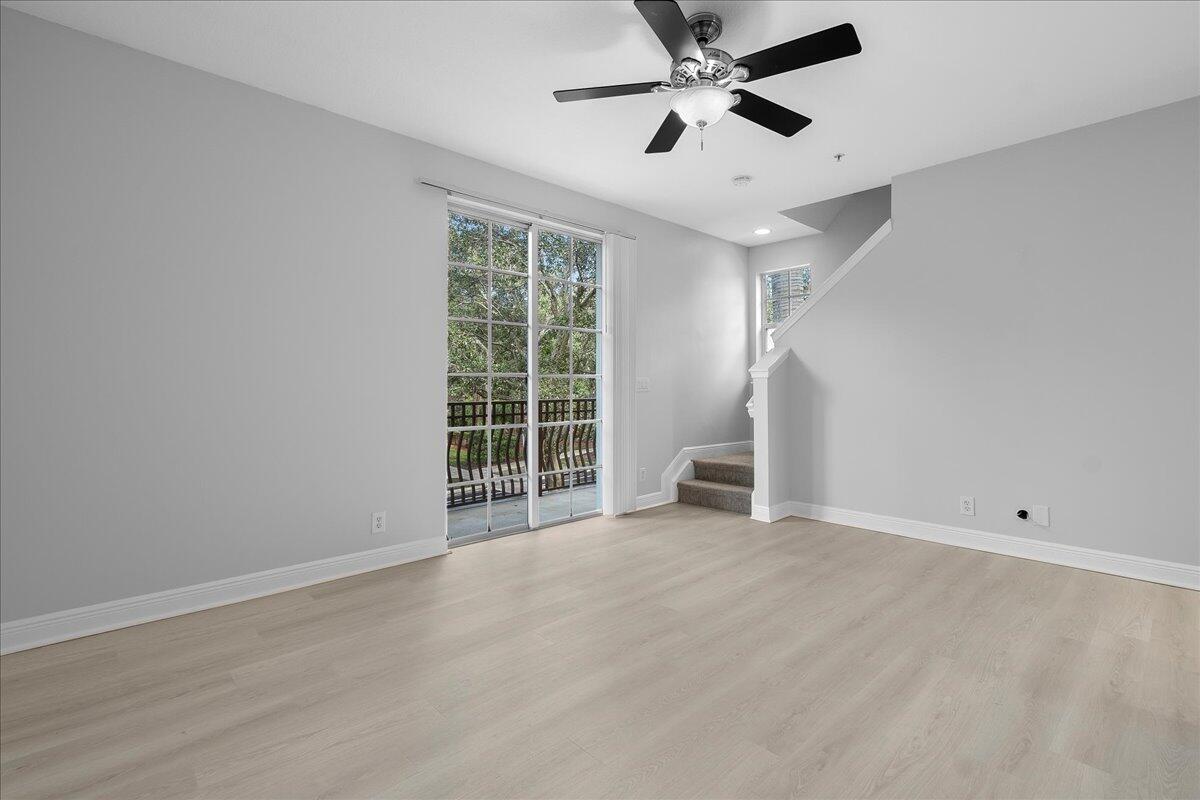802 University Boulevard Jupiter, FL 33458 - Photo 15 of 40 an empty room with windows and ceiling fan