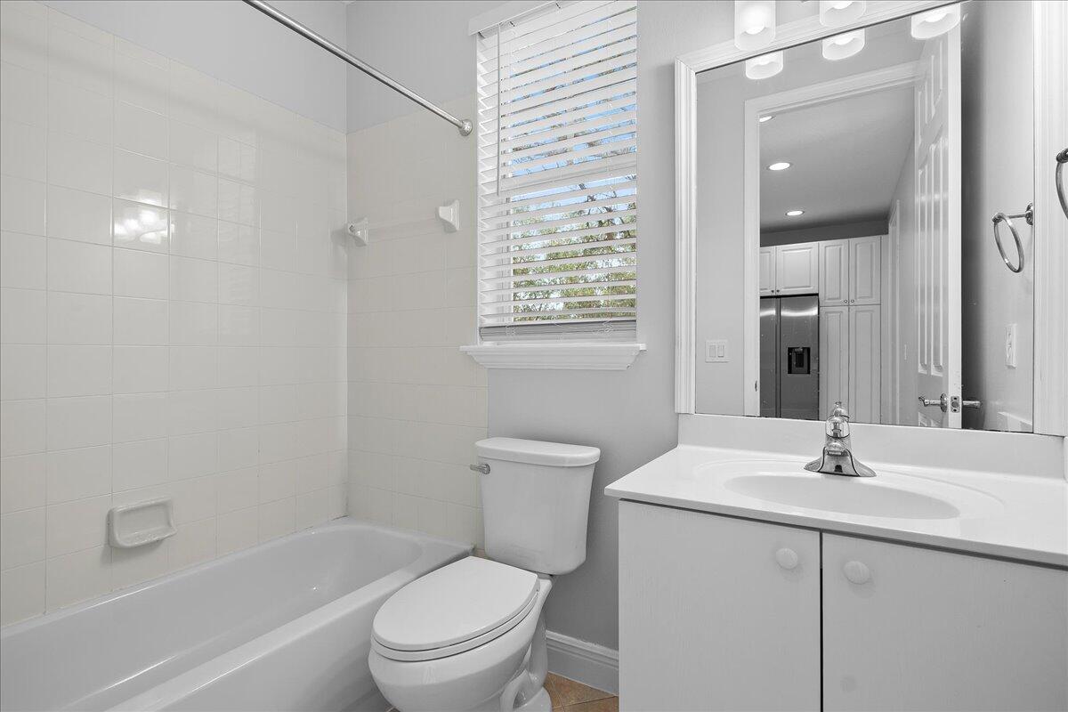 802 University Boulevard Jupiter, FL 33458 - Photo 19 of 40 a bathroom with a sink toilet and shower