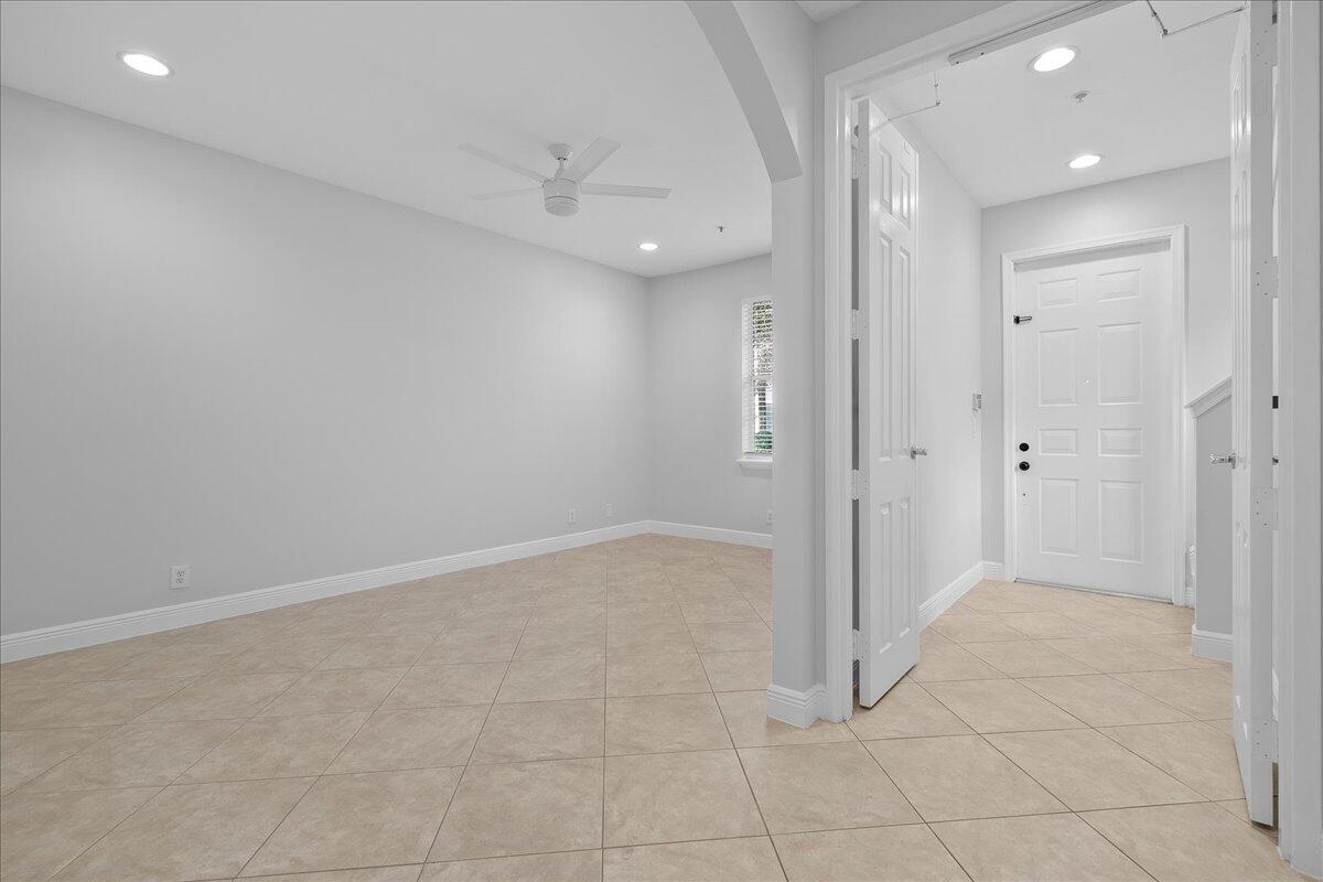 802 University Boulevard Jupiter, FL 33458 - Photo 2 of 40 an empty room with white cabinet and shower