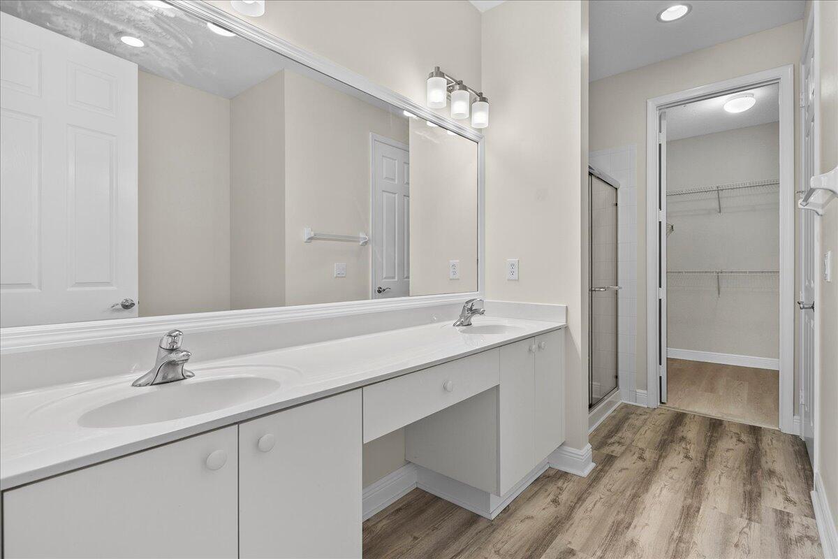 802 University Boulevard Jupiter, FL 33458 - Photo 22 of 40 a bathroom with a sink double vanity and a mirror