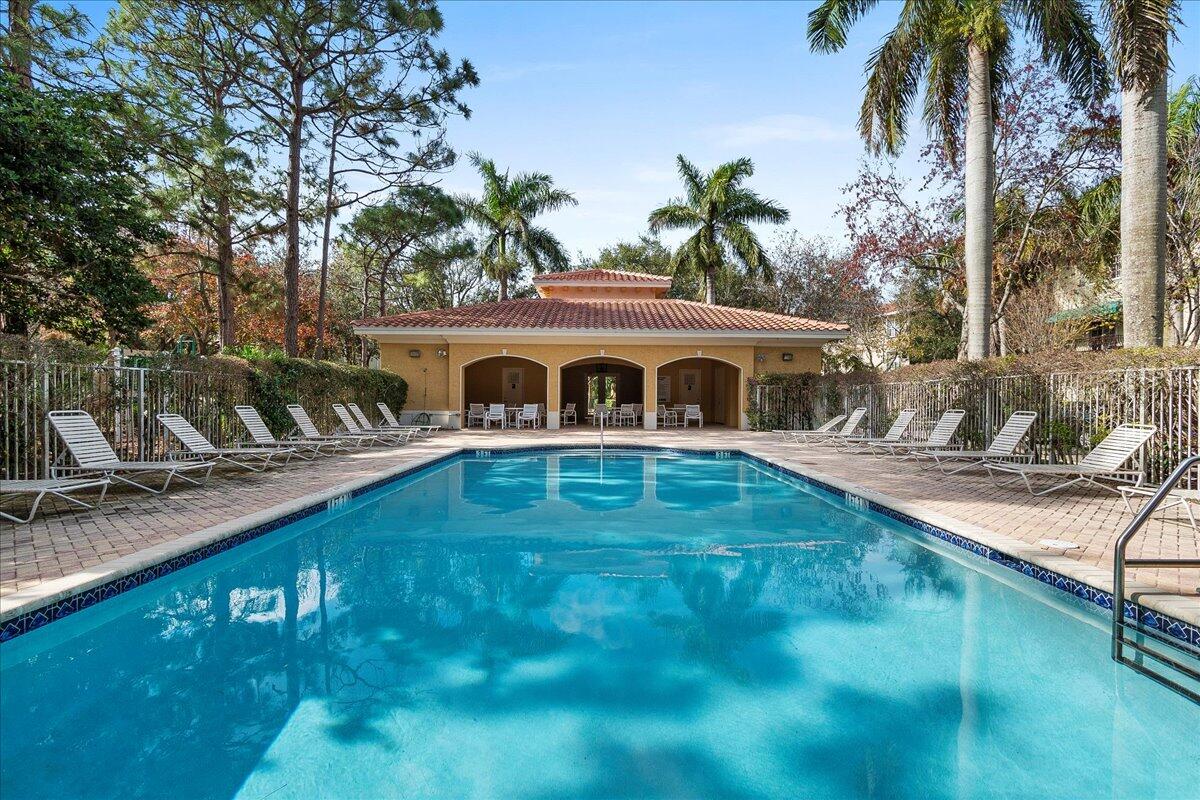 802 University Boulevard Jupiter, FL 33458 - Photo 38 of 40 a front view of house with yard and outdoor seating