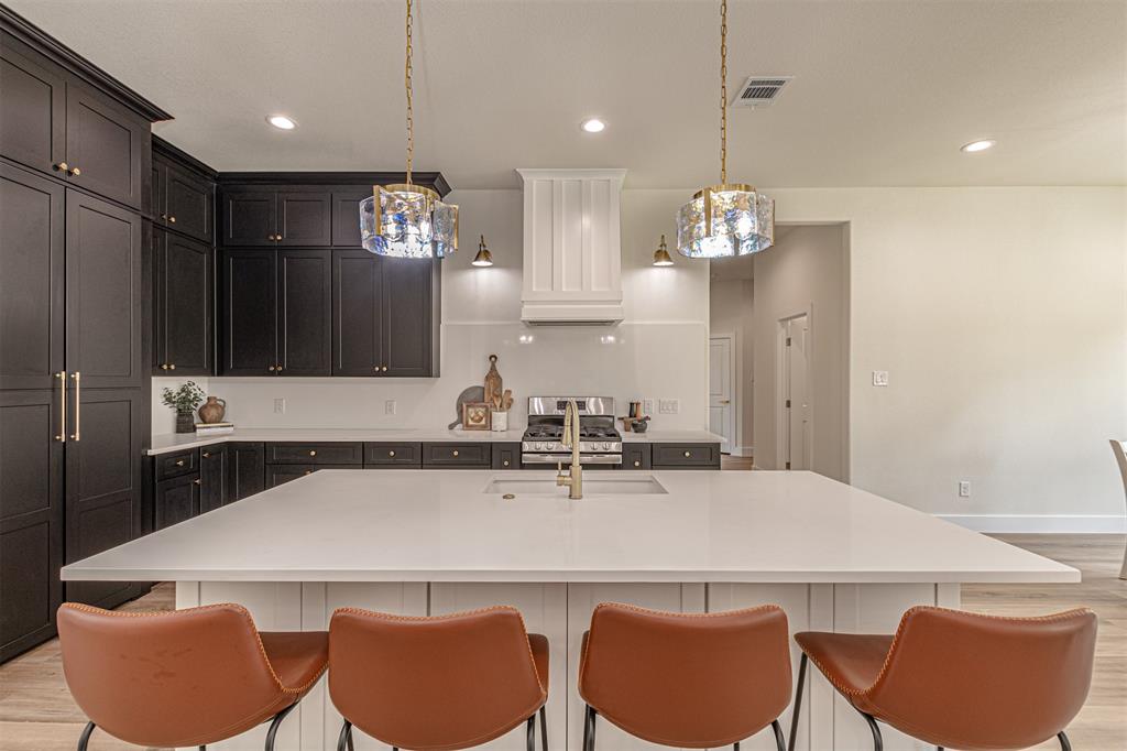 360 Dalton Road Canton, TX 75103 - Photo 10 of 33 Expansive kitchen island with a built-in sink and gold-finish faucet