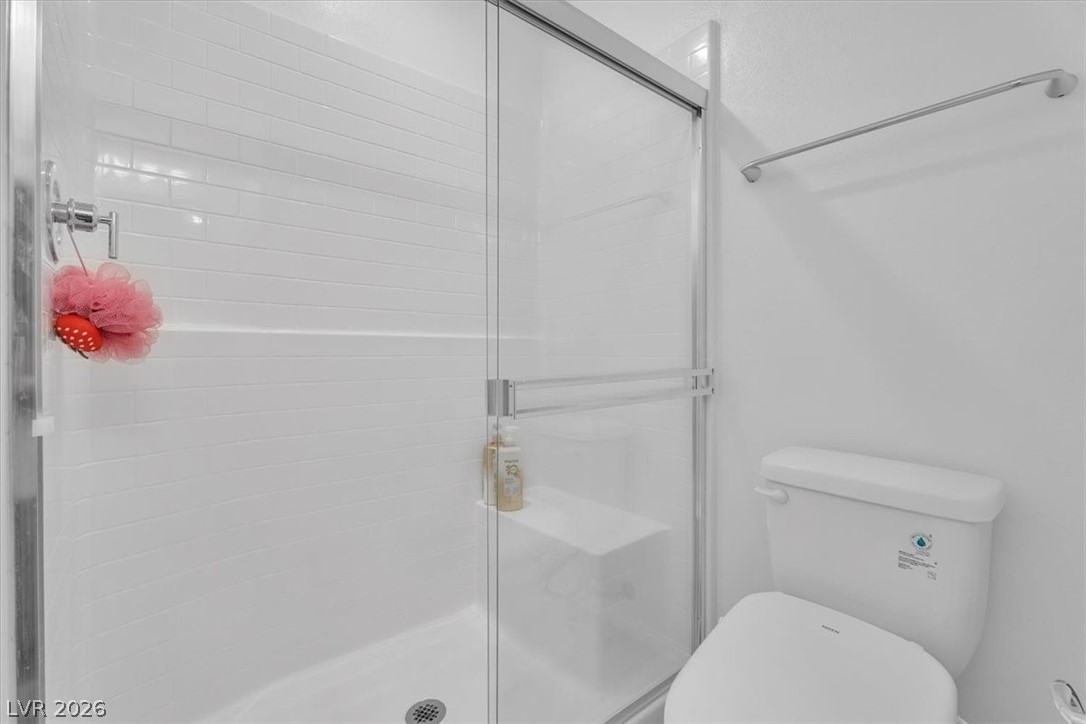 635 Bellus Place Henderson, NV 89015 - Photo 11 of 37 Full bathroom with a stall shower and toilet