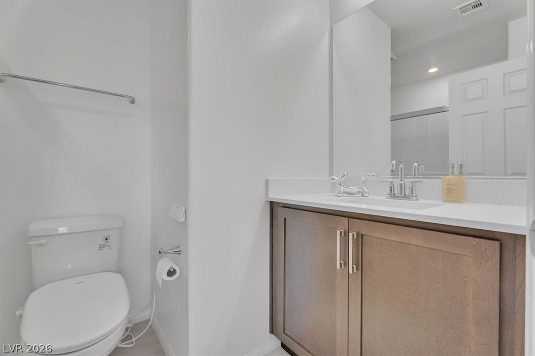 635 Bellus Place Henderson, NV 89015 - Photo 12 of 37 Bathroom with vanity, a shower with shower door, and recessed lighting