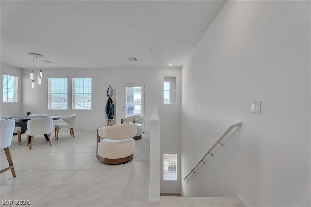 635 Bellus Place Henderson, NV 89015 - Photo 14 of 37 Living room with plenty of natural light and light tile patterned flooring