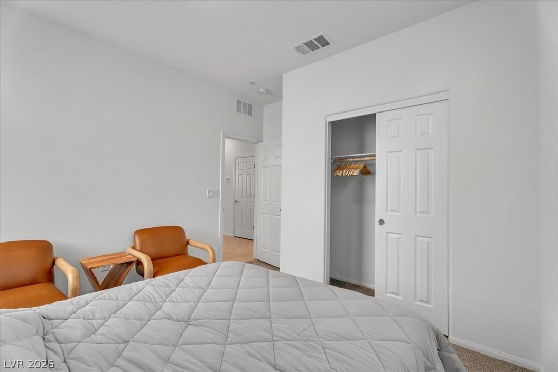 635 Bellus Place Henderson, NV 89015 - Photo 24 of 37 Carpeted bedroom featuring a closet and baseboards