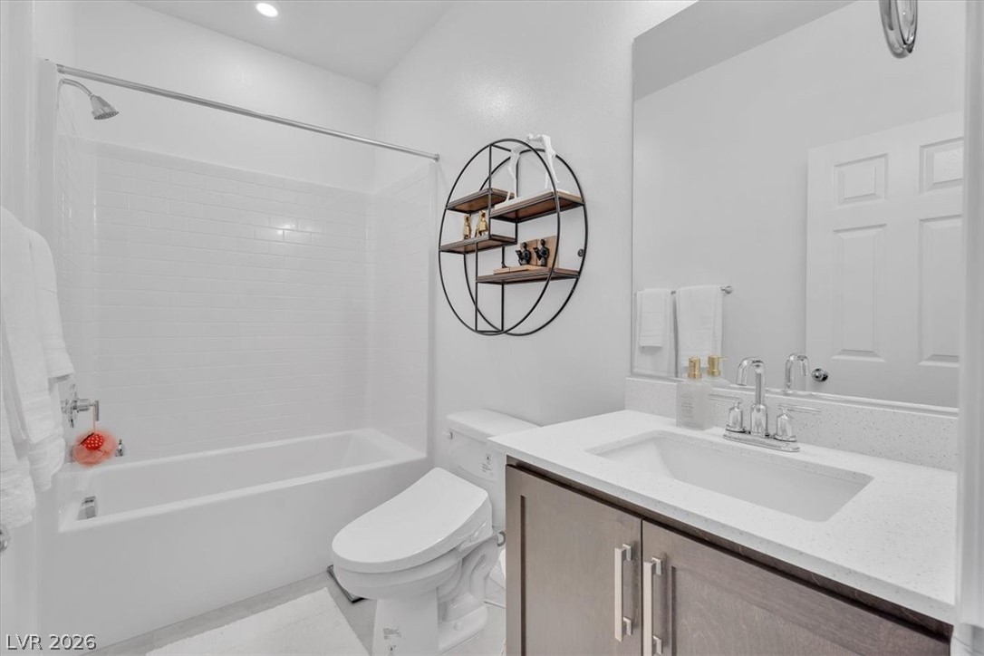 635 Bellus Place Henderson, NV 89015 - Photo 25 of 37 Bathroom featuring washtub / shower combination and vanity