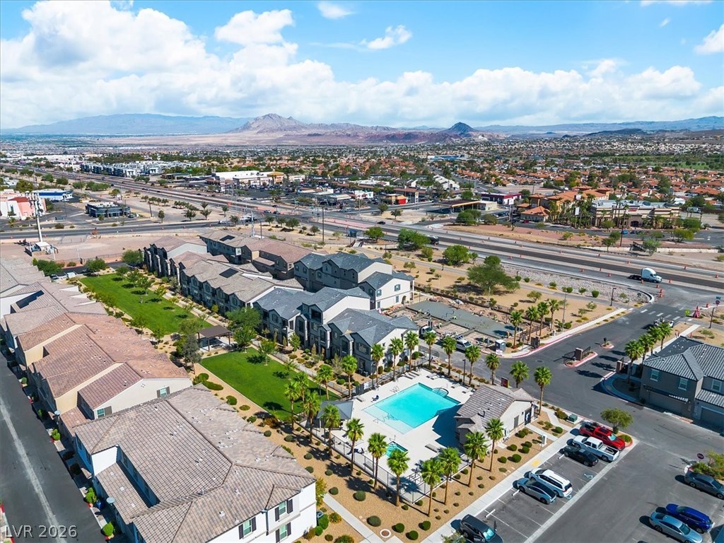 635 Bellus Place Henderson, NV 89015 - Photo 32 of 37 Aerial perspective of suburban area featuring a mountainous background and a pool area