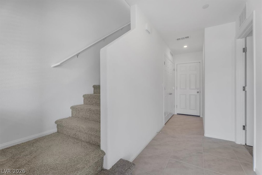 635 Bellus Place Henderson, NV 89015 - Photo 7 of 37 Stairway with recessed lighting and tile patterned flooring