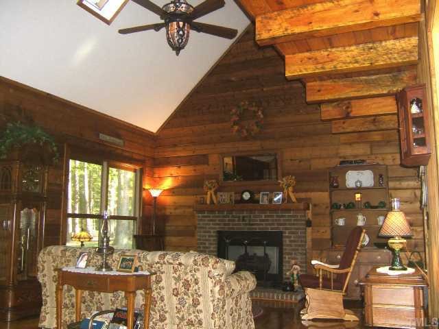 2629 Tar River Road Creedmoor, NC 27522 - Photo 3 of 12 Two-story living room with vaulted ceiling, skylight, & fireplace
