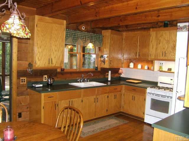 2629 Tar River Road Creedmoor, NC 27522 - Photo 4 of 12 Nice kitchen with updated counter, tile backsplash, & appliances