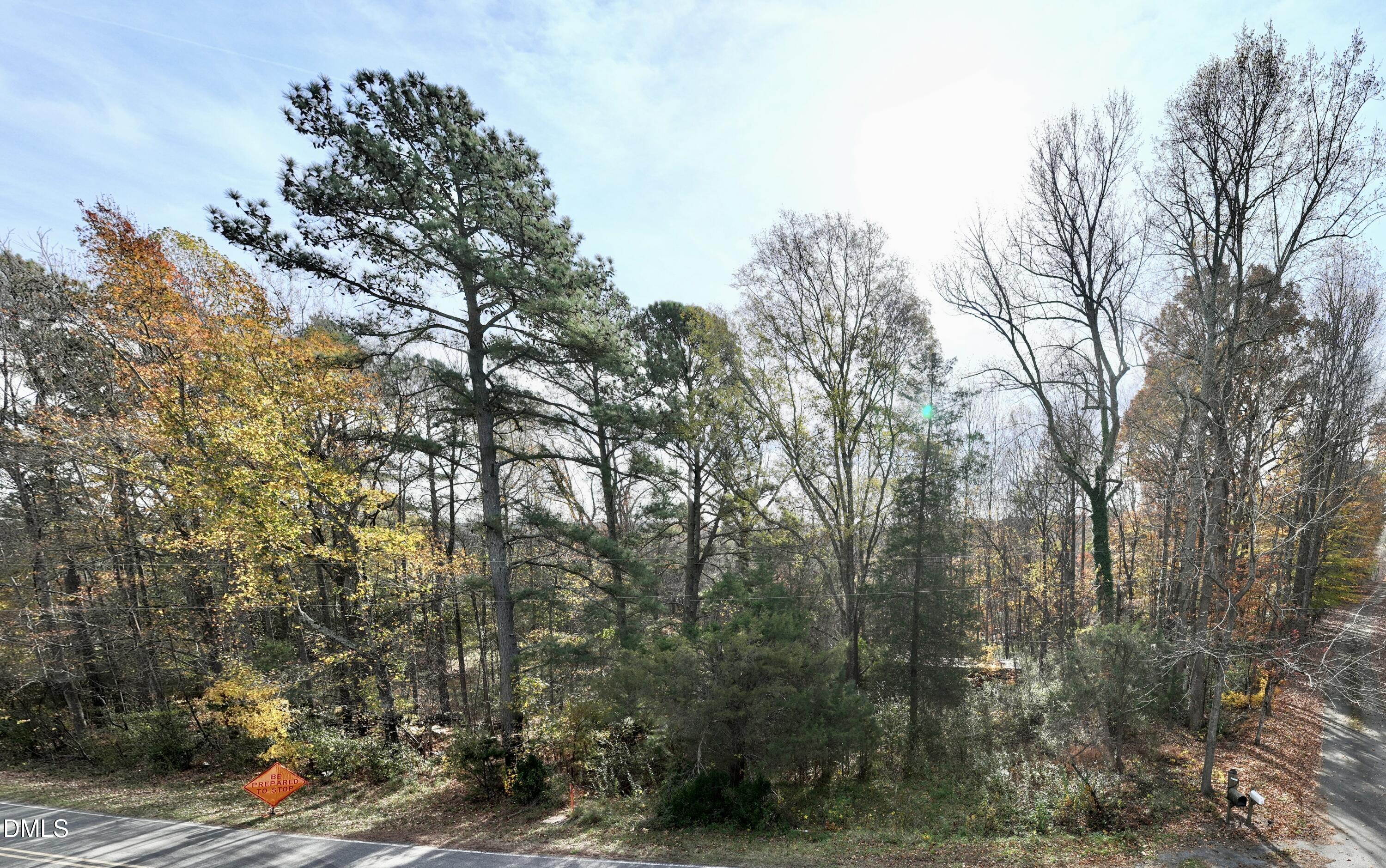 2407 Damascus Church Road Chapel Hill, NC 27516 - Photo 3 of 9 a view of a city with lush green forest