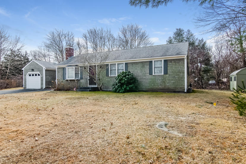 front view of a house with a yard