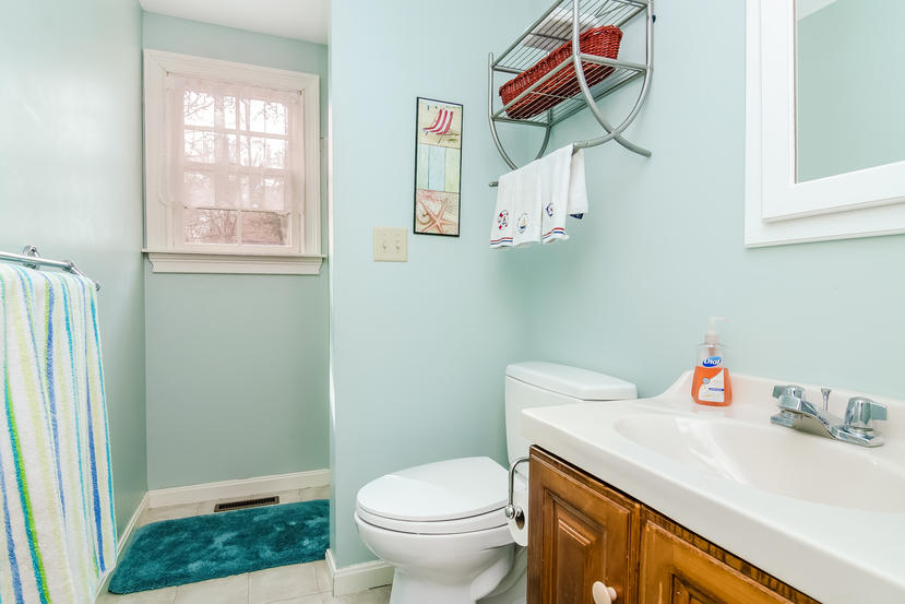 24 Stephen Road Bourne, MA 02532 - Photo 13 of 20 a bathroom with a sink toilet and a window