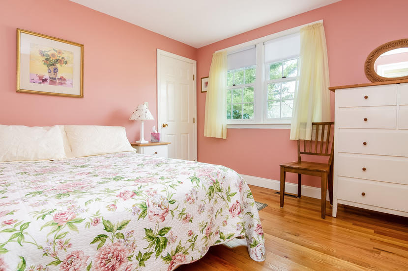 24 Stephen Road Bourne, MA 02532 - Photo 15 of 20 a bedroom with a bed and a lamp on dresser with wooden floor