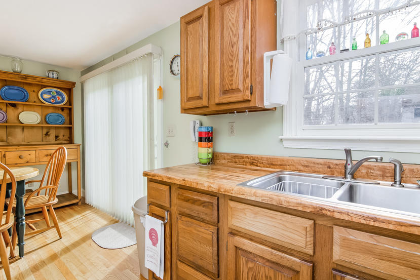 24 Stephen Road Bourne, MA 02532 - Photo 8 of 20 a kitchen with stainless steel appliances granite countertop a sink and a cabinets