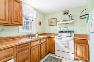 24 Stephen Road Bourne, MA 02532 - Photo 9 of 20 a kitchen with a sink and cabinets