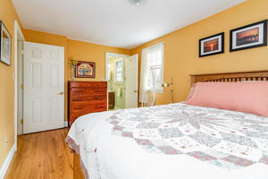 24 Stephen Road Bourne, MA 02532 - Photo 10 of 20 a bedroom with a bed and a painting on the wall