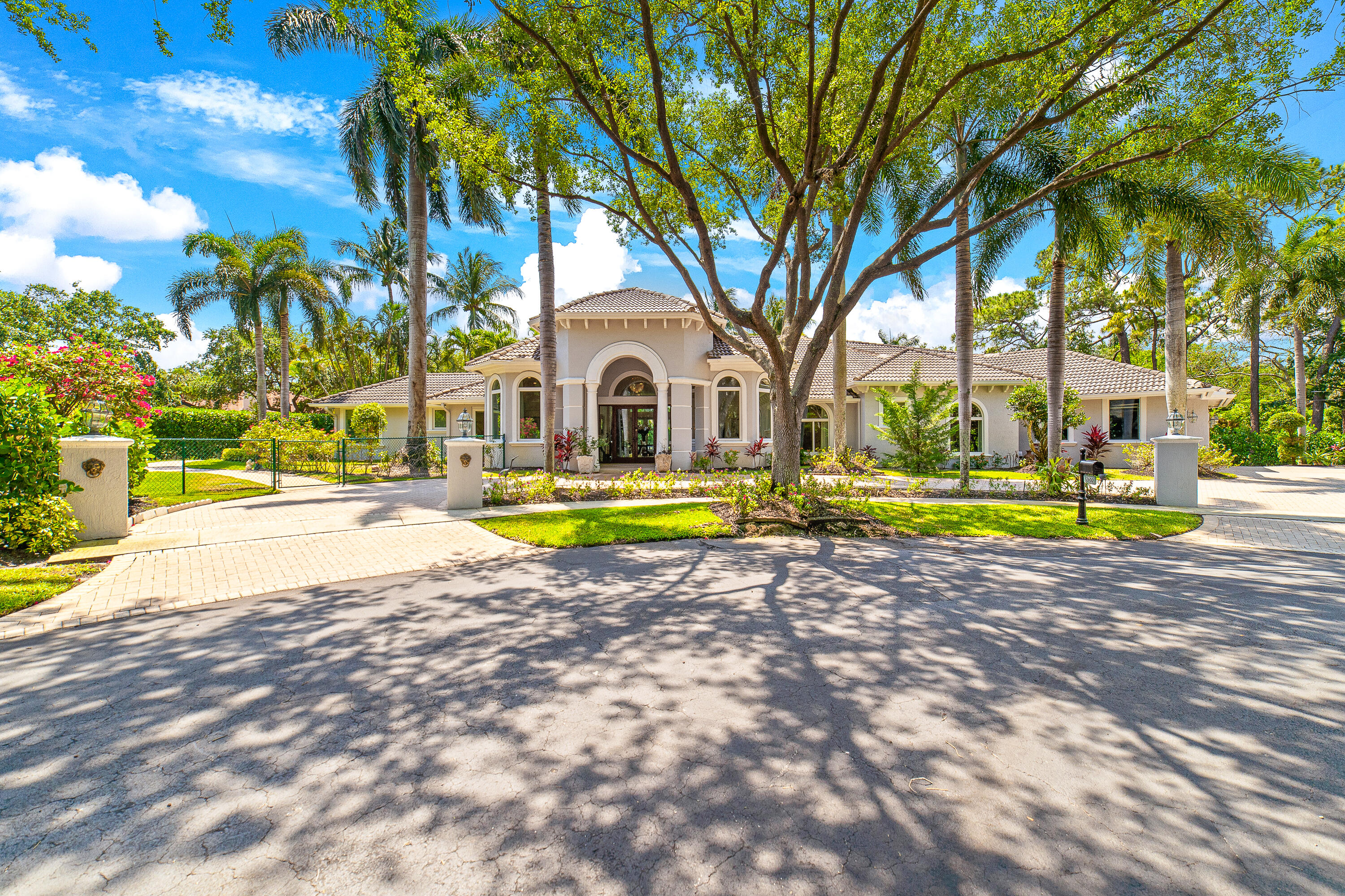 2600 Whispering Oaks Lane Delray Beach, FL 33445 - Photo 1 of 68 a view of a house with swimming pool and sitting area