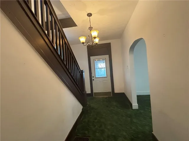 a view of a hallway view with staircase