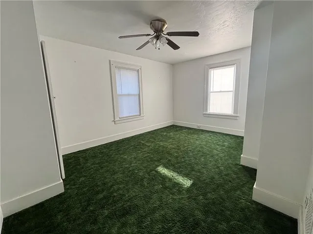 a view of a hallway with a yellow walls
