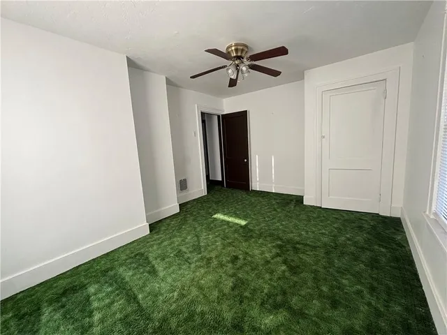 a view of a room that has a window in it