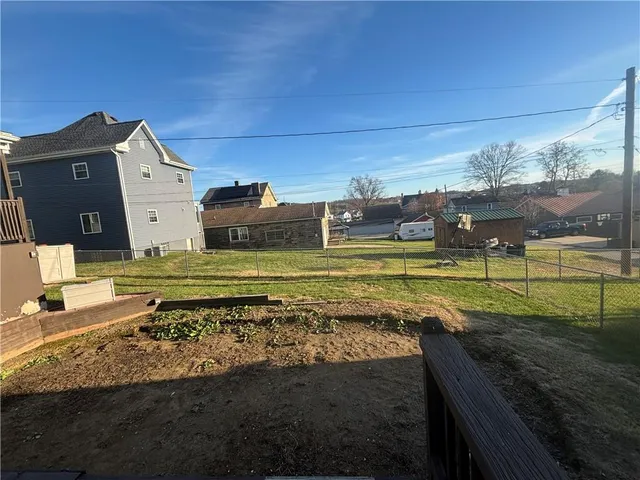 a view of a swimming pool with a yard
