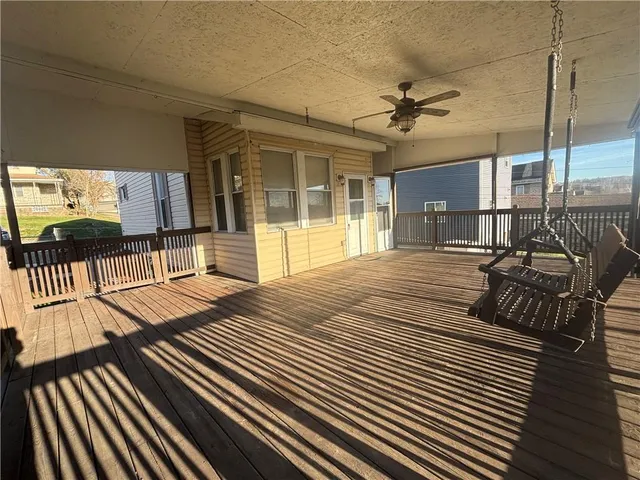 a view of a patio with wooden floor