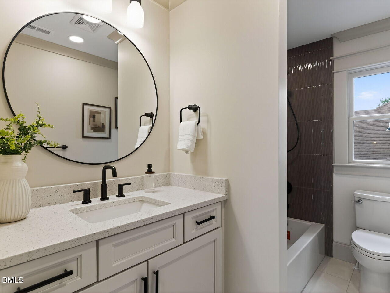 504 Tilden Street Raleigh, NC 27605 - Photo 42 of 58 a bathroom with a sink and a mirror