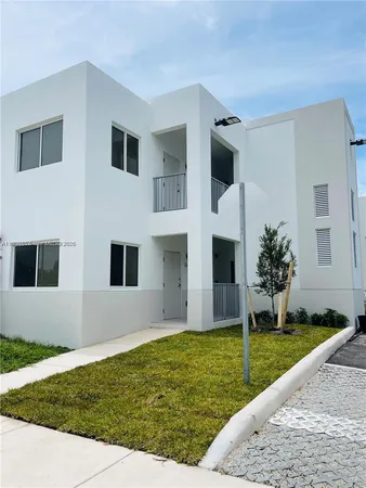 a view of house with yard