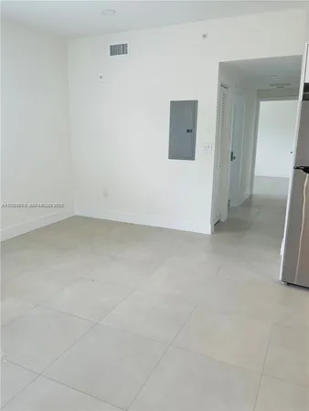 an empty room with a bench