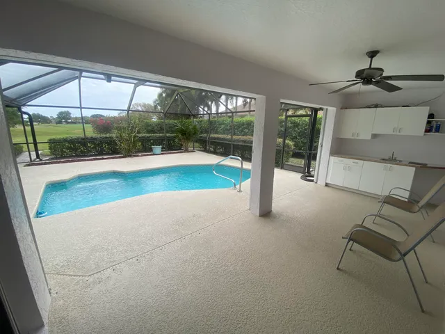 a view of a living room and floor to ceiling window