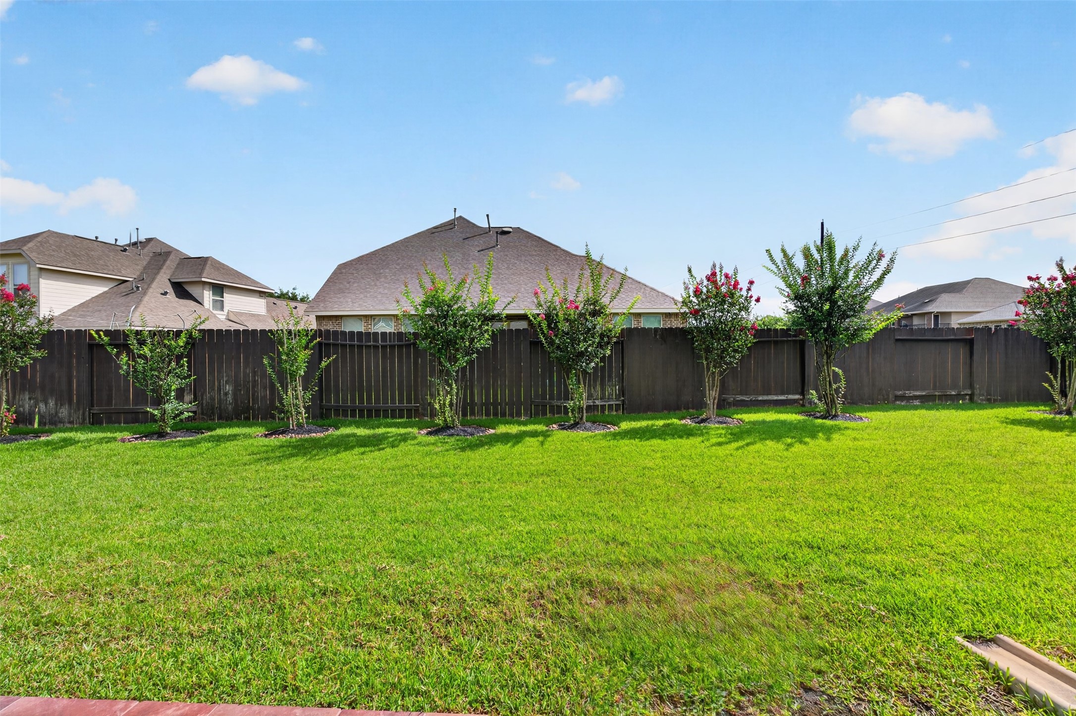 18202 Wedgewood Bluff Court Spring, TX 77379 - Photo 47 of 50 Wide backyard view with plenty of open green space for outdoor enjoyment.